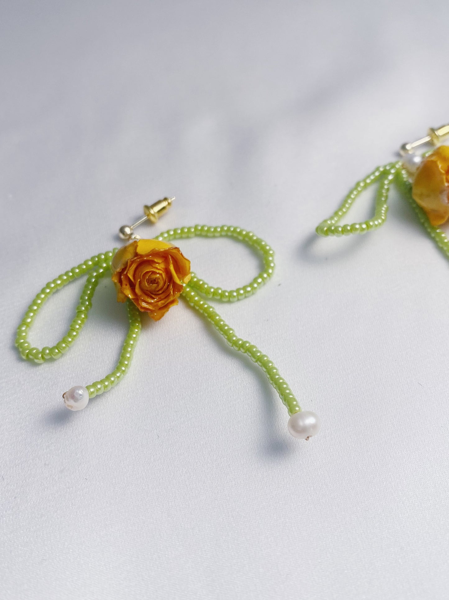 Dainty rose bead bow drops